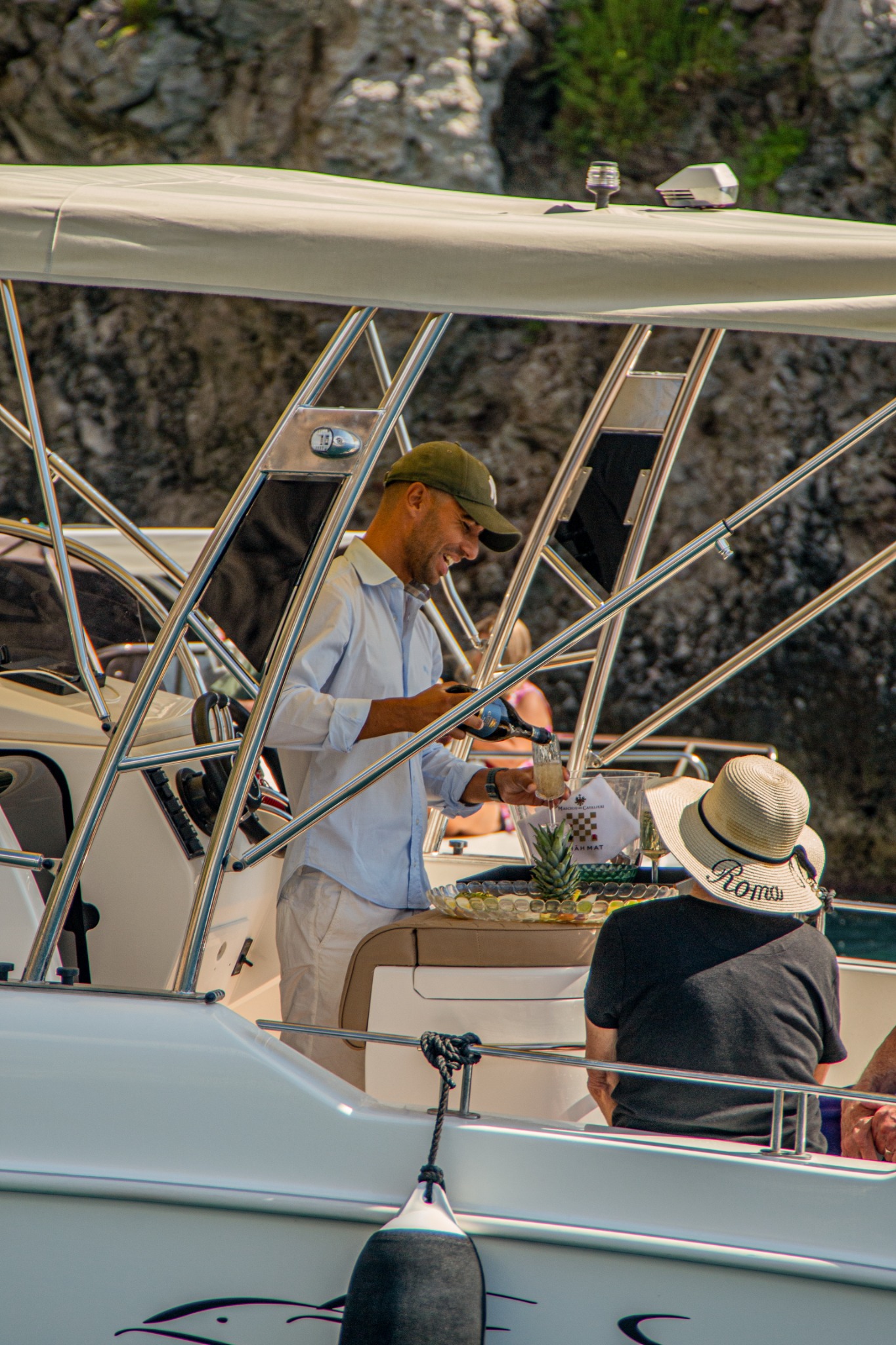 Sparkling wine being served aboard the Aquabat 850 Sport Infinity Lux