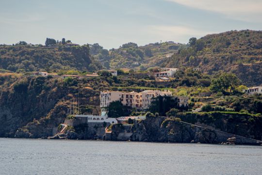 Buildings set above the rocky coastline of Lipari